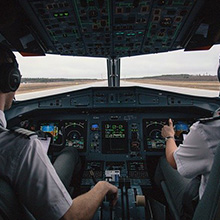 two pilots in cockpit of aeroplane